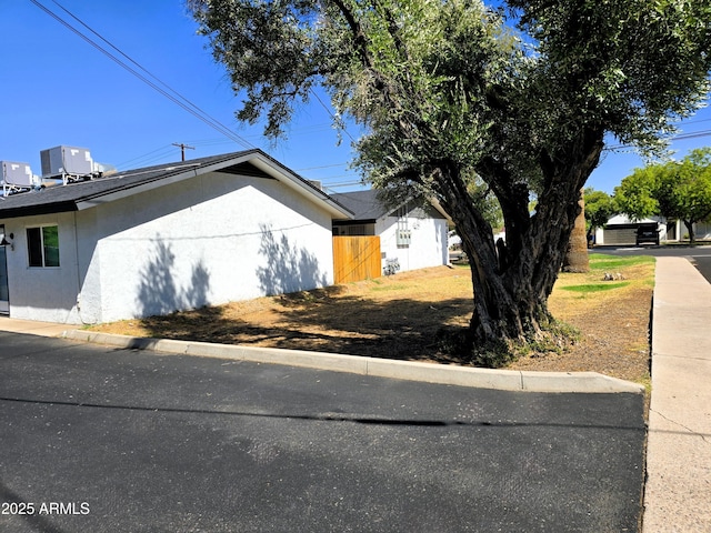 4450 N Longview Ave, Phoenix, AZ 85014 - view of property exterior featuring cooling unit and stucco siding