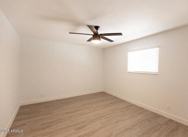 4450 N Longview Ave, Phoenix, AZ 85014 - empty room with ceiling fan, light wood finished floors, and baseboards