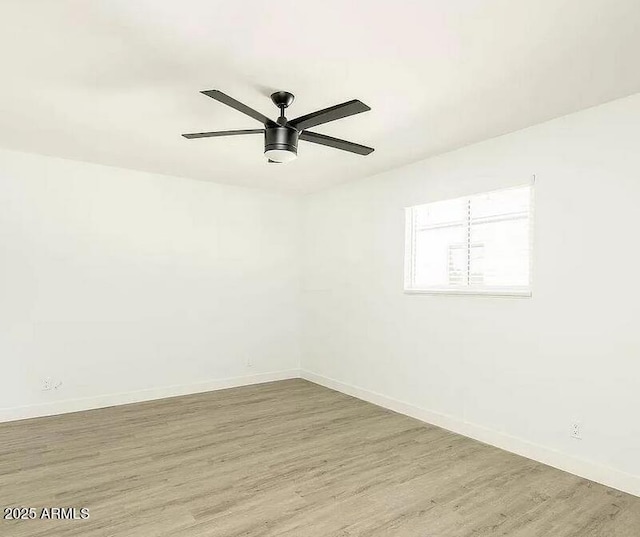 4450 N Longview Ave, Phoenix, AZ 85014 - unfurnished room featuring wood finished floors, baseboards, and ceiling fan