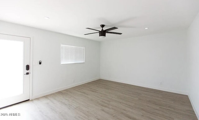 4450 N Longview Ave, Phoenix, AZ 85014 - spare room featuring wood finished floors, ceiling fan, baseboards, and recessed lighting