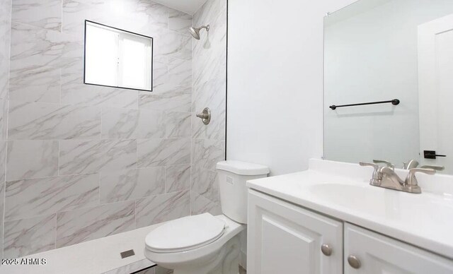 4450 N Longview Ave, Phoenix, AZ 85014 - bathroom with vanity, a tile shower, and toilet