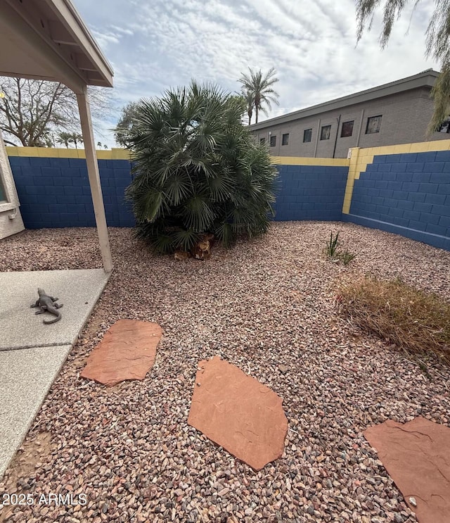 view of yard with a fenced backyard