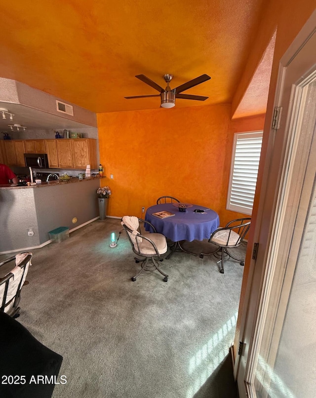 carpeted bedroom featuring a textured ceiling and visible vents