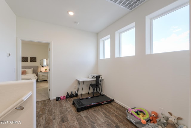 workout area featuring visible vents, recessed lighting, baseboards, and dark wood-style flooring