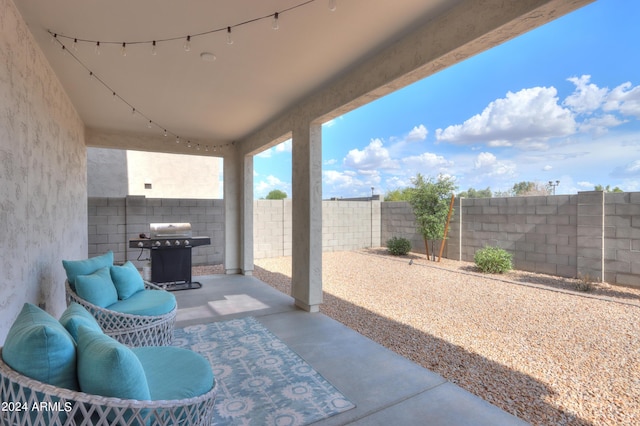 view of patio / terrace featuring area for grilling and a fenced backyard