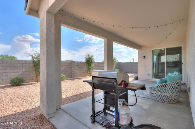 view of patio with grilling area and a fenced backyard