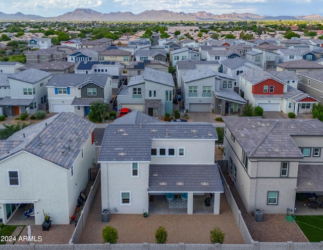 aerial view featuring a mountain view and a residential view