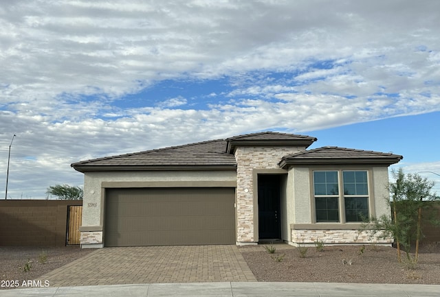 prairie-style home featuring a garage