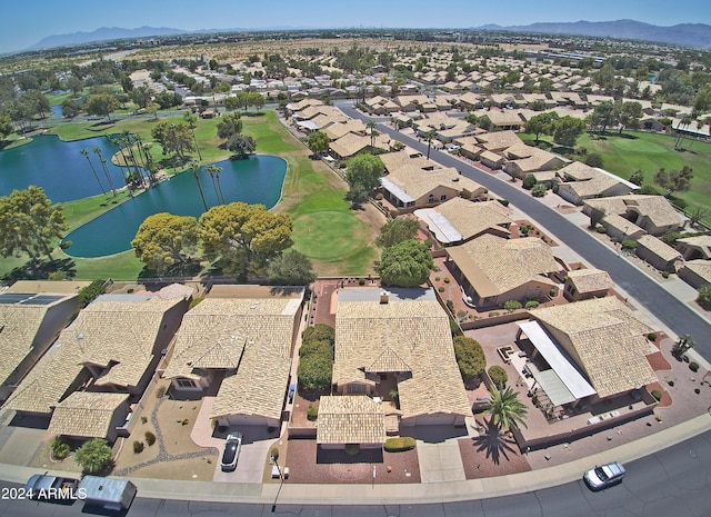 bird's eye view with a water and mountain view