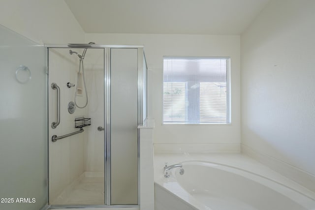 bathroom with shower with separate bathtub