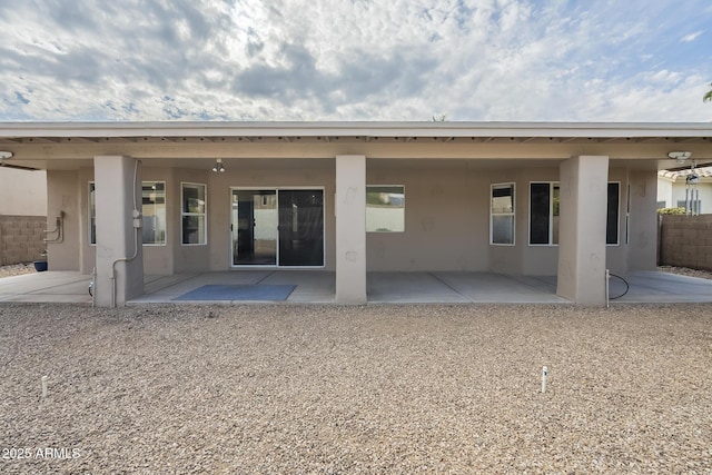 back of property featuring a patio