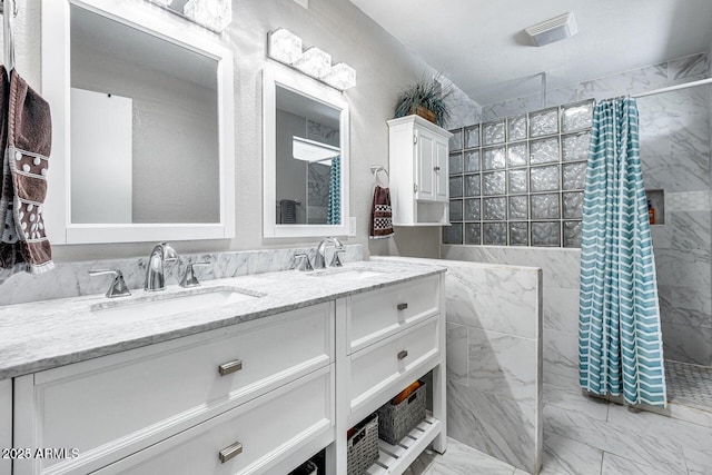 3102 W Betty Elyse Ln, Phoenix, AZ 85053 - full bathroom with marble finish flooring, a walk in shower, and double vanity