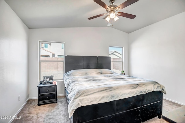 bedroom with lofted ceiling, light carpet, ceiling fan, and baseboards