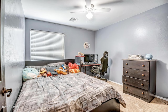 bedroom with baseboards, a ceiling fan, visible vents, and light colored carpet