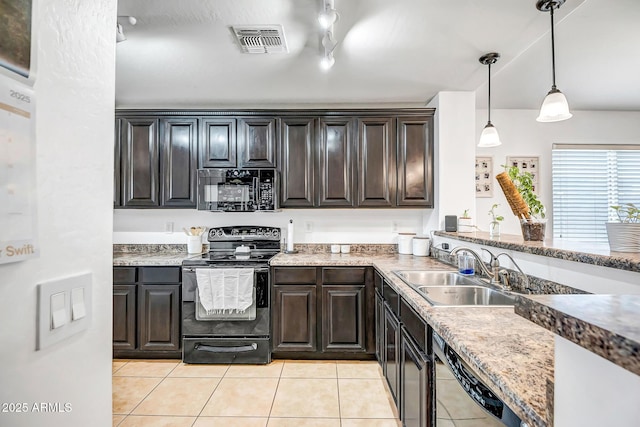 kitchen featuring pendant lighting, light tile patterned floors, visible vents, a sink, and black appliances