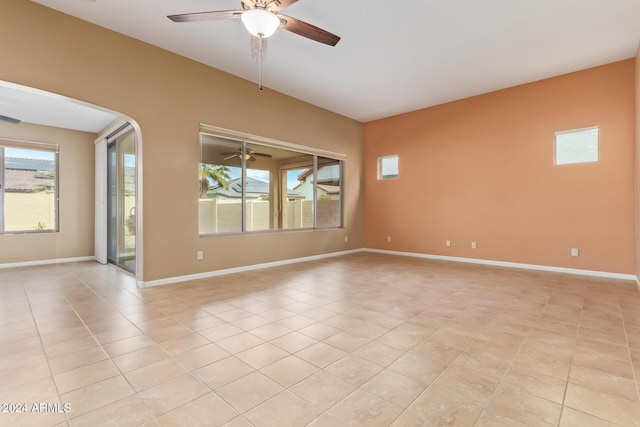 tiled empty room with ceiling fan