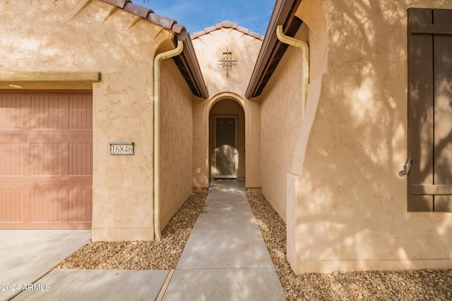 doorway to property featuring a garage