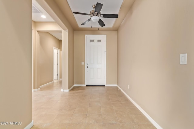 tiled entrance foyer featuring ceiling fan