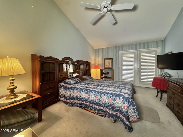 bedroom with carpet floors, ceiling fan, and vaulted ceiling