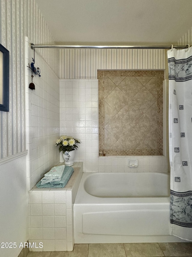 bathroom with tile patterned flooring, a bath, and a shower with curtain