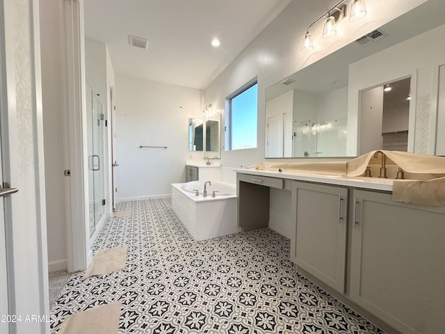 bathroom featuring vanity and separate shower and tub