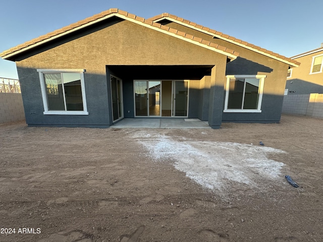 rear view of house featuring a patio area