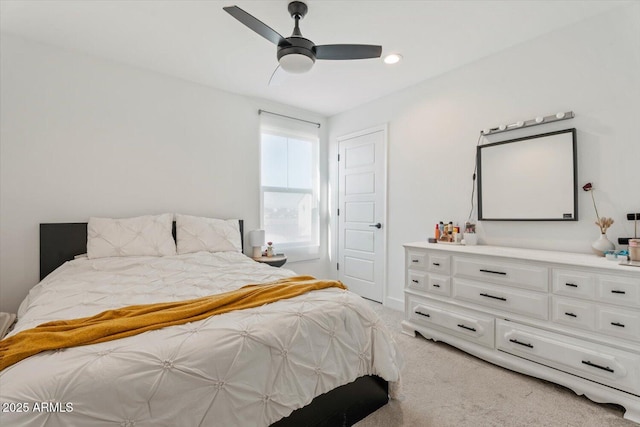 carpeted bedroom featuring ceiling fan