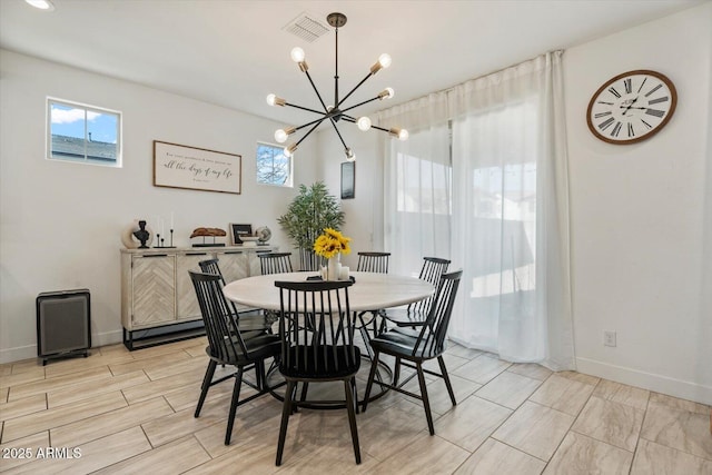 dining space featuring a chandelier