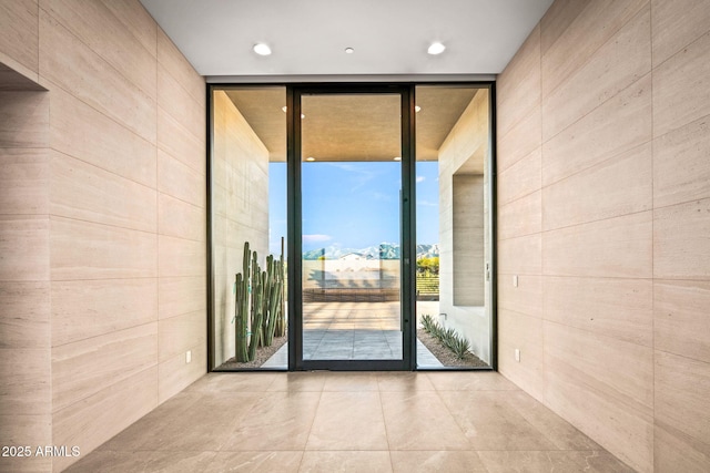 interior space featuring a wall of windows and recessed lighting