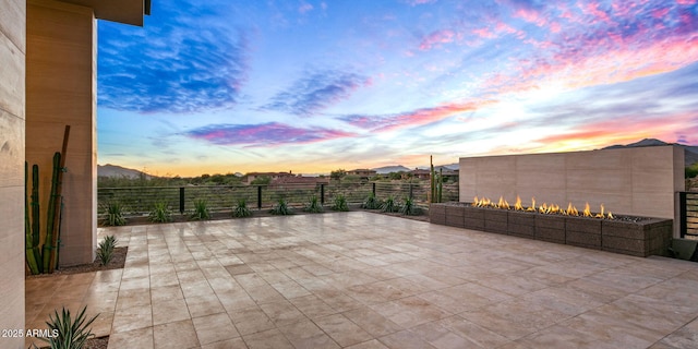 view of patio terrace at dusk