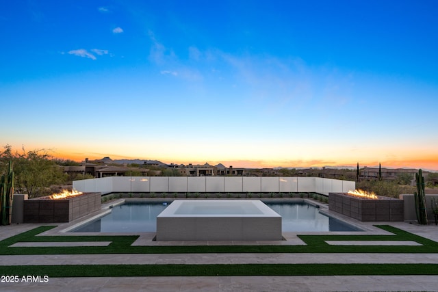 view of pool featuring a fenced in pool, a patio, a fire pit, and fence