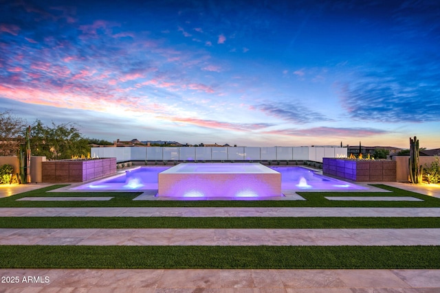 view of swimming pool with a jacuzzi, a fenced in pool, and a fenced backyard