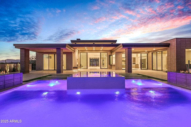 pool with fence and a patio