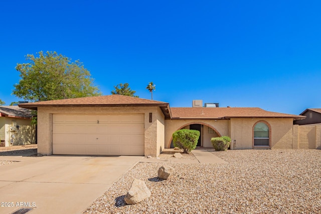 4957 W Onyx Ave, Glendale, AZ 85302 - ranch-style home with concrete driveway, an attached garage, and stucco siding