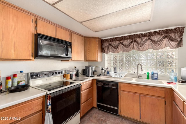 4957 W Onyx Ave, Glendale, AZ 85302 - kitchen with black appliances, light countertops, and tile patterned floors
