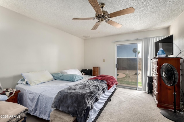 4957 W Onyx Ave, Glendale, AZ 85302 - carpeted bedroom with access to exterior, a textured ceiling, and ceiling fan