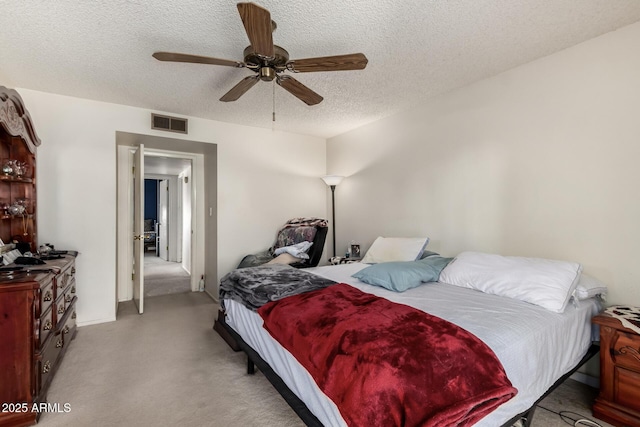 4957 W Onyx Ave, Glendale, AZ 85302 - carpeted bedroom with a textured ceiling and ceiling fan