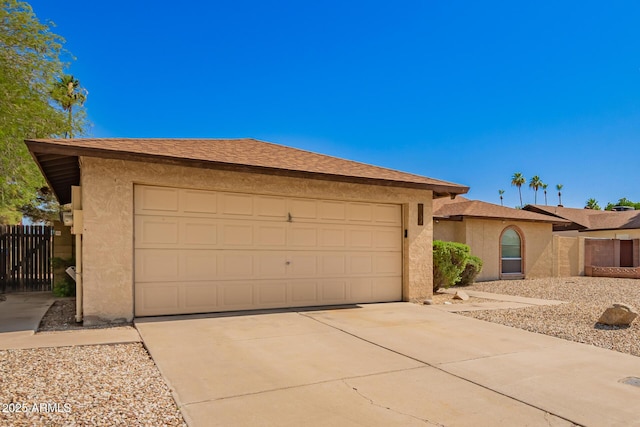 4957 W Onyx Ave, Glendale, AZ 85302 - view of front of home with stucco siding, driveway, and an attached garage