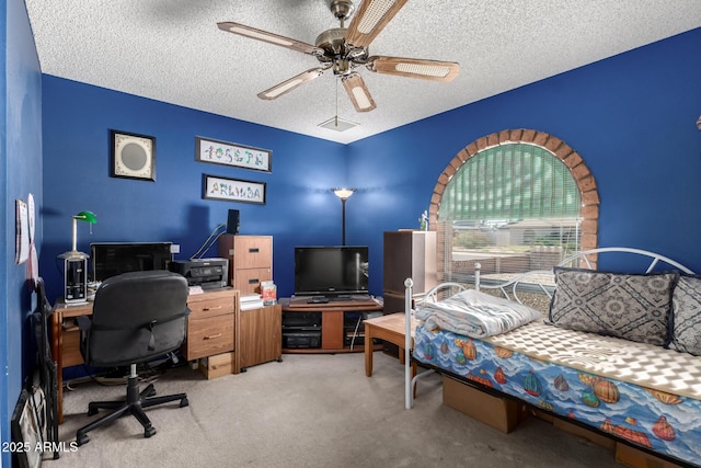4957 W Onyx Ave, Glendale, AZ 85302 - carpeted bedroom with a desk, a textured ceiling, and ceiling fan