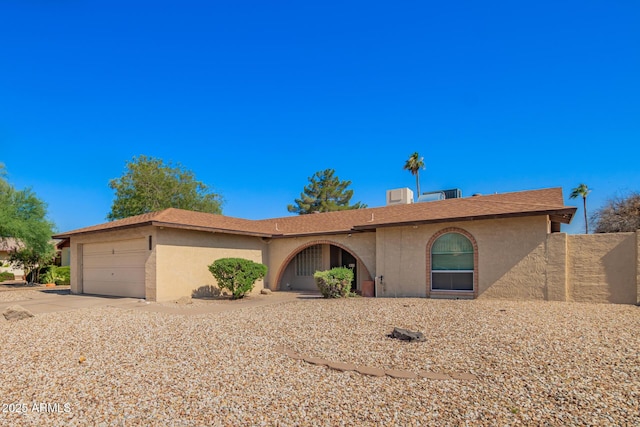 4957 W Onyx Ave, Glendale, AZ 85302 - single story home featuring stucco siding, a garage, and driveway