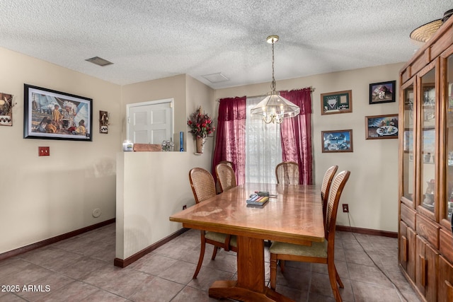 4957 W Onyx Ave, Glendale, AZ 85302 - dining space with a chandelier, light tile patterned flooring, and a textured ceiling