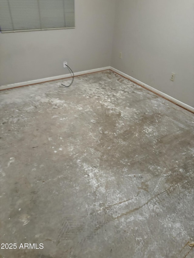 empty room with baseboards