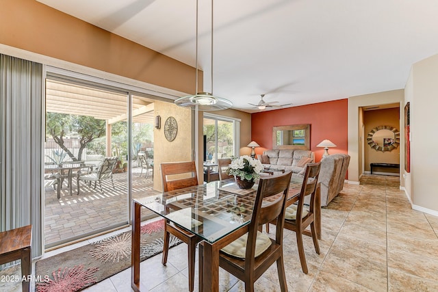 16857 W Villagio Dr, Surprise, AZ 85387 - dining space featuring ceiling fan, baseboards, and light tile patterned floors
