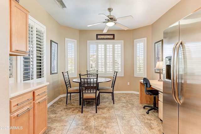 16857 W Villagio Dr, Surprise, AZ 85387 - dining space with a ceiling fan, baseboards, light tile patterned flooring, and an office area