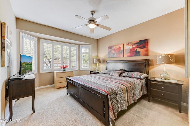 16857 W Villagio Dr, Surprise, AZ 85387 - bedroom featuring light colored carpet, baseboards, and a ceiling fan