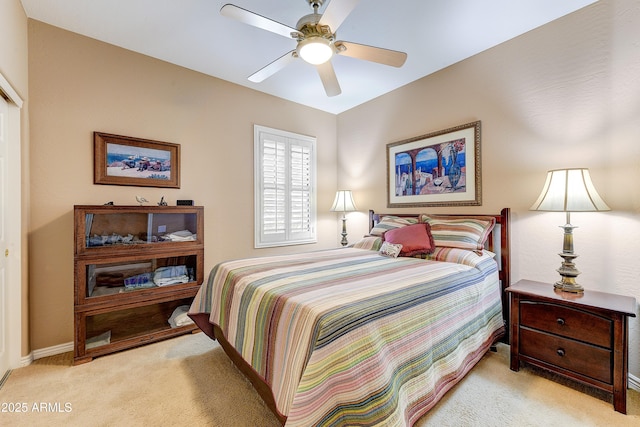 16857 W Villagio Dr, Surprise, AZ 85387 - bedroom featuring light colored carpet, baseboards, and a ceiling fan