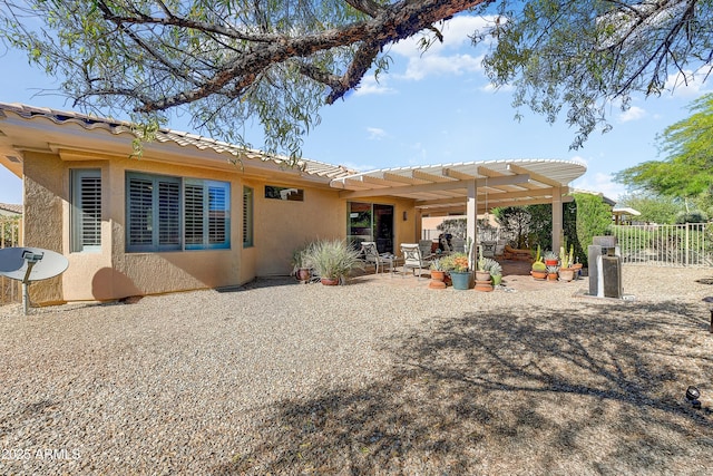 16857 W Villagio Dr, Surprise, AZ 85387 - rear view of property featuring stucco siding, a pergola, fence, a patio, and a tiled roof