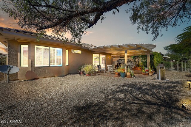 16857 W Villagio Dr, Surprise, AZ 85387 - rear view of house with stucco siding, fence, a pergola, a patio, and a tile roof