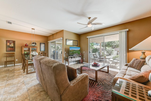16857 W Villagio Dr, Surprise, AZ 85387 - living area featuring a ceiling fan and baseboards
