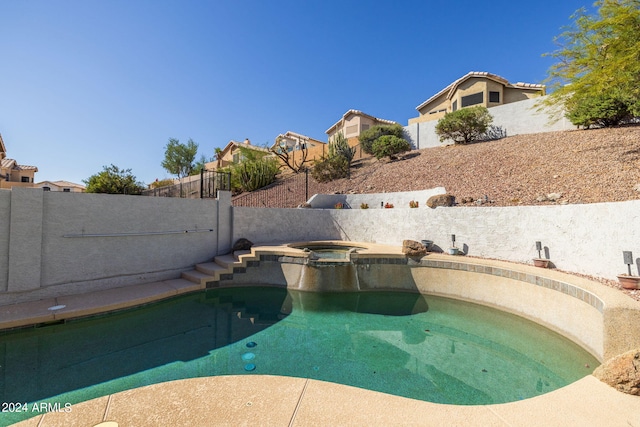 view of pool featuring an in ground hot tub